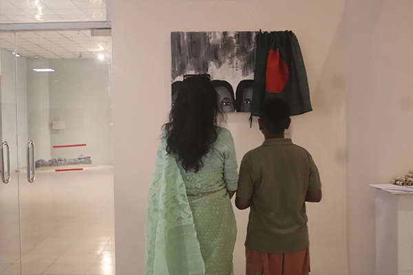 Visitors reading exhibition materials