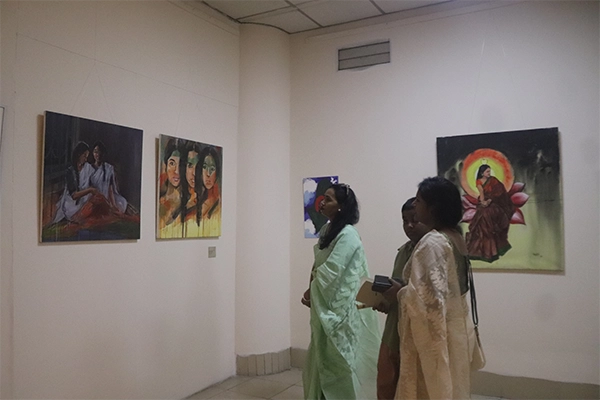 Visitors reading exhibition materials